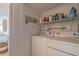 The laundry room is fully equipped with storage and a washer and dryer at 15000 Gulf Blvd # 901, Madeira Beach, FL 33708