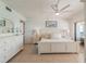 Bright main bedroom features tile flooring, a ceiling fan, and access to a private balcony overlooking the ocean at 15000 Gulf Blvd # 901, Madeira Beach, FL 33708
