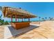 Outdoor poolside bar and grilling area with ocean views and access to the beach at 15000 Gulf Blvd # 901, Madeira Beach, FL 33708