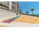 Outdoor shuffleboard court with ocean views and beachfront access at 15000 Gulf Blvd # 901, Madeira Beach, FL 33708
