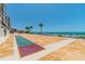 Outdoor shuffleboard court with ocean views and beachfront access at 15000 Gulf Blvd # 901, Madeira Beach, FL 33708