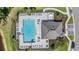 Aerial view of a community pool with a pool house, lounge seating, and landscaping at 17592 Nectar Flume Dr, Land O Lakes, FL 34638