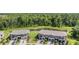 Aerial view of modern townhomes with private driveways and stunning water views at 17592 Nectar Flume Dr, Land O Lakes, FL 34638
