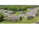 Aerial shot of new townhomes, community pool, and lush green surroundings at 17592 Nectar Flume Dr, Land O Lakes, FL 34638