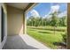 Back patio with beautiful view of pond and landscaping at 17592 Nectar Flume Dr, Land O Lakes, FL 34638