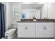 Spacious bathroom with double vanity, granite countertop and decorative accents at 17592 Nectar Flume Dr, Land O Lakes, FL 34638