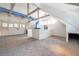 Bright bonus room with vaulted ceilings, exposed beams and a large carpeted area at 18324 Jorene Rd, Odessa, FL 33556