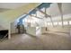 Bright bonus room with vaulted ceilings, exposed beams and a large carpeted area at 18324 Jorene Rd, Odessa, FL 33556
