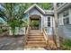 Inviting front porch with wooden stairs and a charming architectural design at 18324 Jorene Rd, Odessa, FL 33556