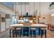 Open kitchen with a central island, pendant lighting, and ample counter space for cooking and entertaining at 18324 Jorene Rd, Odessa, FL 33556