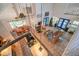 Aerial view of open-concept living space showcasing high ceilings and tile floors connecting kitchen and dining areas at 18324 Jorene Rd, Odessa, FL 33556