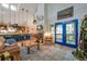 Open-concept living area featuring a fireplace, kitchen, and inviting blue patio doors at 18324 Jorene Rd, Odessa, FL 33556