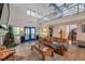 Spacious living room with a soaring ceiling, tiled floors, and a staircase leading to the upper level at 18324 Jorene Rd, Odessa, FL 33556