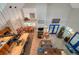 Aerial view of open-concept living space showcasing high ceilings and tile floors connecting kitchen and dining areas at 18324 Jorene Rd, Odessa, FL 33556