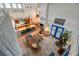 Aerial view of open-concept living space showcasing high ceilings and tile floors connecting kitchen and dining areas at 18324 Jorene Rd, Odessa, FL 33556