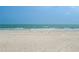 Beautiful beach view with white sand, blue skies, and crystal water at 18610 Gulf Blvd # 208, Indian Shores, FL 33785