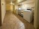Convenient shared laundry room in the building with multiple washers and dryers at 18610 Gulf Blvd # 208, Indian Shores, FL 33785
