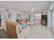 Comfortable living room with neutral paint and tile flooring at 18610 Gulf Blvd # 208, Indian Shores, FL 33785
