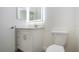 Bright bathroom features white vanity, quartz countertop, LED mirror, and toilet for a modern look at 1906 Canterbury Ln # 20, Sun City Center, FL 33573