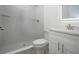 Beautiful bathroom with a tiled walk-in shower, toilet and a modern vanity at 1906 Canterbury Ln # 20, Sun City Center, FL 33573