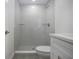 Updated bathroom with a tiled walk-in shower, a toilet, and a modern vanity at 1906 Canterbury Ln # 20, Sun City Center, FL 33573