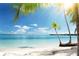 Tropical beach with white sand, turquoise water, and palm trees under a clear blue sky at 1906 Canterbury Ln # 20, Sun City Center, FL 33573