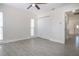 Spacious bedroom with tile floors, white trim, and a large double door closet at 1906 Canterbury Ln # 20, Sun City Center, FL 33573