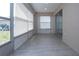 Enclosed sunroom with tile floor and multiple windows letting in lots of natural light at 1906 Canterbury Ln # 20, Sun City Center, FL 33573