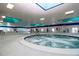 Inviting indoor hot tub with tiled surround, ideal for relaxation at 1906 Canterbury Ln # 20, Sun City Center, FL 33573