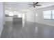 Open floor plan featuring tile floors, bright lighting, and views into the kitchen at 1906 Canterbury Ln # 20, Sun City Center, FL 33573