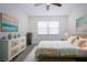 Serene main bedroom featuring neutral décor, ample natural light, and coastal-inspired accents at 1906 Canterbury Ln # 20, Sun City Center, FL 33573