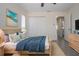 Comfortable bedroom with a large bed, walk-in closet, and ensuite bathroom at 1906 Canterbury Ln # 20, Sun City Center, FL 33573