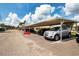 Assigned covered parking space for residents, offering protection and convenience at 1906 Canterbury Ln # 20, Sun City Center, FL 33573