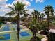 Scenic aerial view of well maintained pickleball courts with palm trees and clubhouse at 1906 Canterbury Ln # 20, Sun City Center, FL 33573