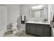 Modern bathroom with vanity and grey color palette at 19409 Weymouth Dr, Land O Lakes, FL 34638