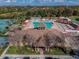 Lovely aerial view of the community center, surrounded by lush landscaping and amenities at 19409 Weymouth Dr, Land O Lakes, FL 34638