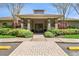 Welcoming entrance to the community center, framed by beautiful landscaping and a well-kept walkway at 19409 Weymouth Dr, Land O Lakes, FL 34638