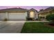 Charming single-Gathering home featuring a two-car garage and a beautifully landscaped front yard at 19409 Weymouth Dr, Land O Lakes, FL 34638