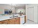 Bright kitchen has granite counters, and is open to the dining and living area at 19409 Weymouth Dr, Land O Lakes, FL 34638