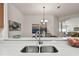 Bright kitchen has granite counters, and is open to the dining and living area at 19409 Weymouth Dr, Land O Lakes, FL 34638