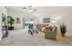Comfortable living space with plush seating, neutral tones, and slider to the backyard at 19409 Weymouth Dr, Land O Lakes, FL 34638
