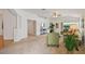 Spacious living area with a vaulted ceiling, neutral carpet, and an open floor plan at 19409 Weymouth Dr, Land O Lakes, FL 34638