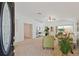 Bright living room with large windows, neutral carpet, and stylish furnishings at 19409 Weymouth Dr, Land O Lakes, FL 34638