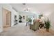 Inviting living room featuring neutral carpeting, ample natural light, and cozy decor at 19409 Weymouth Dr, Land O Lakes, FL 34638