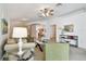 Bright living room with plush carpeting and neutral walls at 19409 Weymouth Dr, Land O Lakes, FL 34638