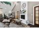 Stylish lounge area with cozy seating, a fireplace, and elegant decor perfect for relaxing and entertaining guests at 19409 Weymouth Dr, Land O Lakes, FL 34638