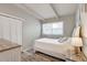 Cozy bedroom with ample natural light, wood floors, and neutral tones at 2018 Windsor Way, Tampa, FL 33619