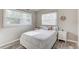 Bedroom with bright natural light, wood flooring, and light walls at 2018 Windsor Way, Tampa, FL 33619