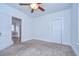 An empty bedroom with neutral carpet and bright natural light at 205 W Emma St, Tampa, FL 33603