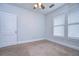 A bright bedroom with neutral walls and plush carpeting at 205 W Emma St, Tampa, FL 33603